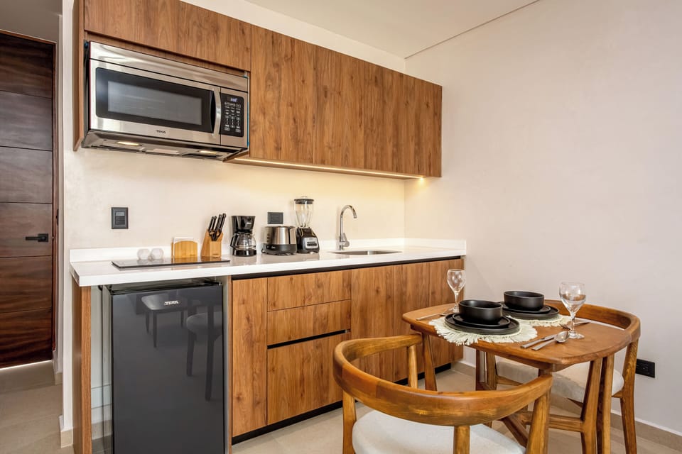 Luxury Apartment, Pool View | Private kitchen | Microwave, stovetop, cookware/dishes/utensils