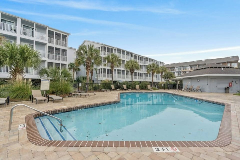 Relax on a lounge chair while the kids splash in the pool.
