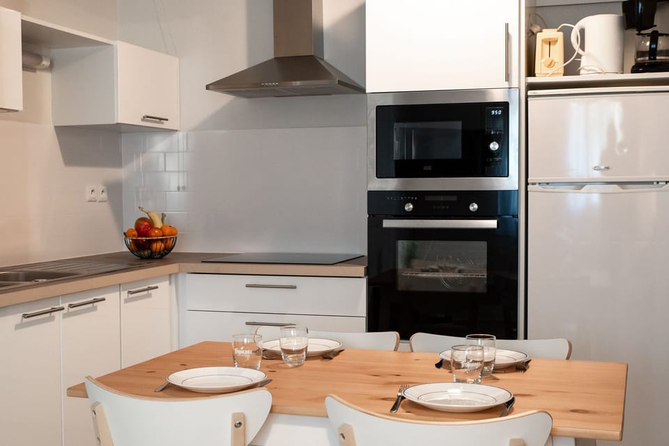 The open kitchen and dining area makes it easy to prepare and enjoy meals together.