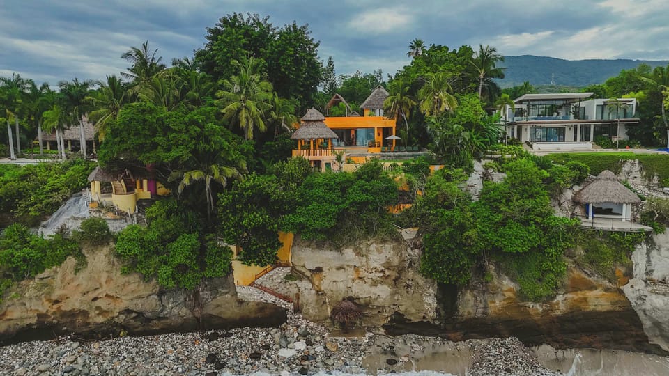 Casa Tara is perched on a scenic oceanfront cliff in Punta de Mita. Enjoy peaceful sea views and direct access to the beach below.