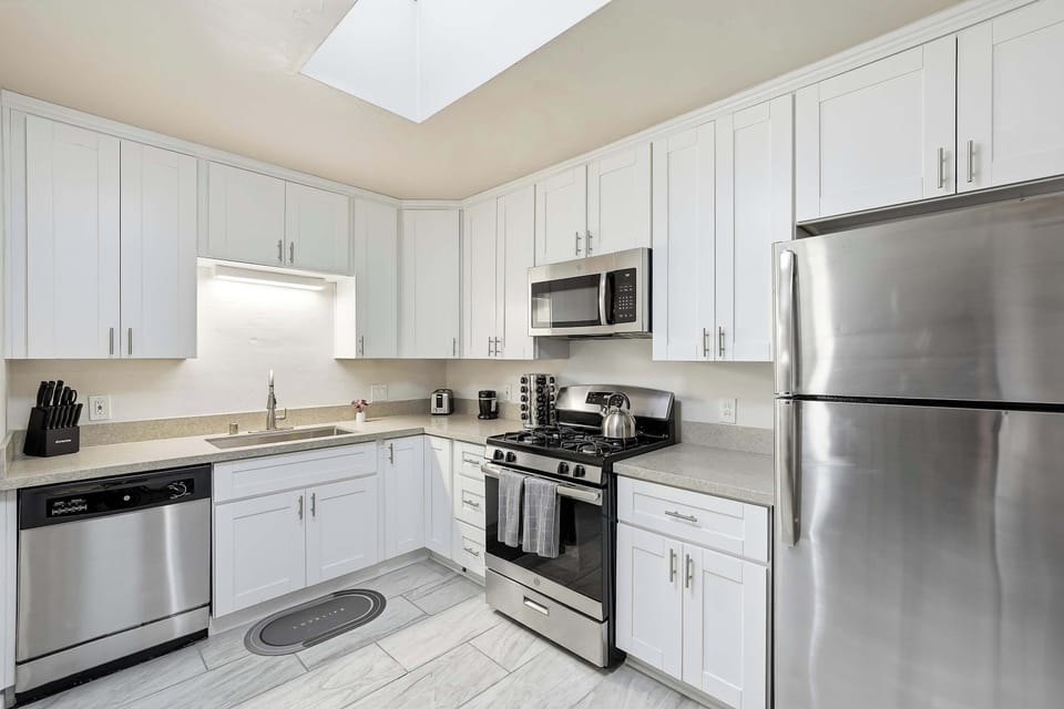 Fully equipped modern kitchen with stainless steel appliances