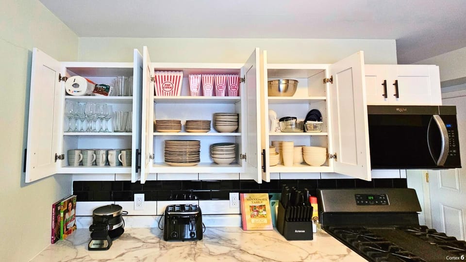 Well stocked kitchen with lots of dishes.  Even plastic dishes for the kids
