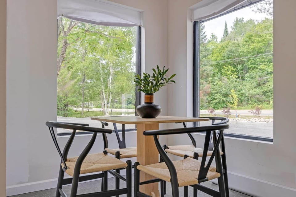 Charming dining nook with a view, ideal for morning coffee or a quiet workspace.