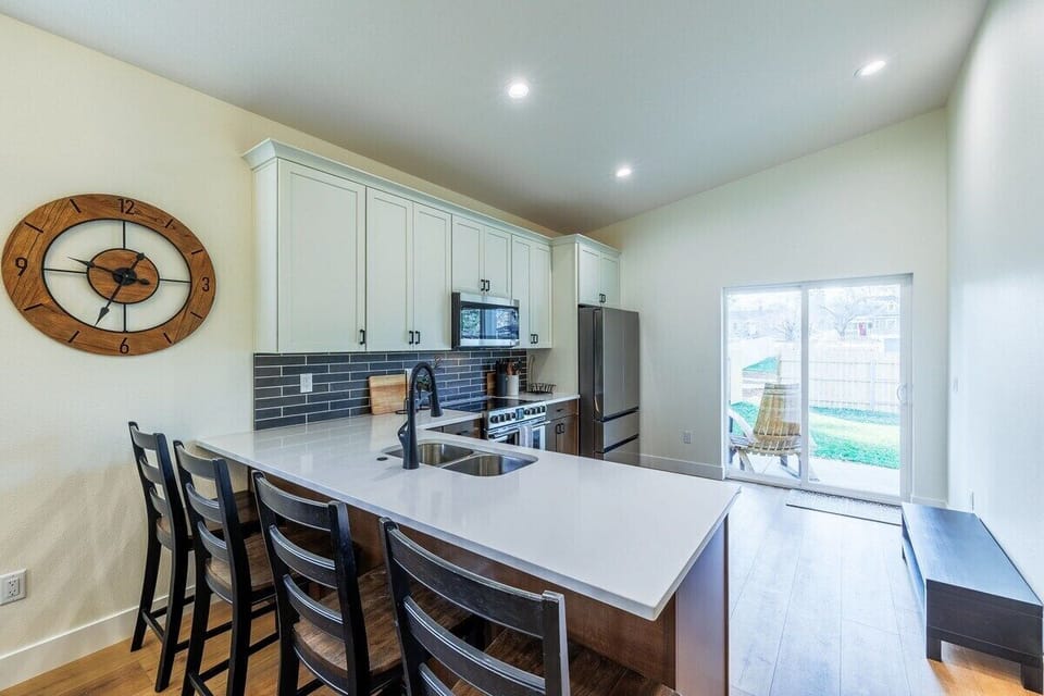 Extra seating at the bar makes it easy to gather, snack, or sip while you cook.
