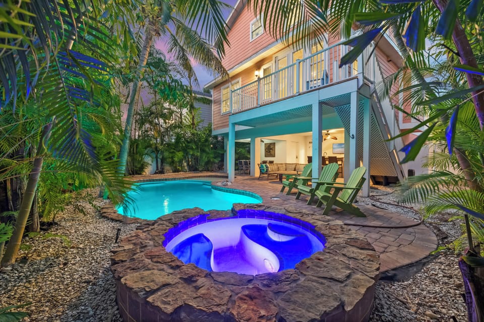 Unwind in a hot tub amid palms. Perfect for evening relaxation.