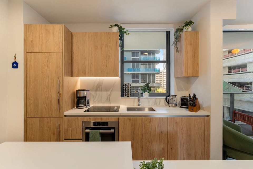 Kitchen detail with contemporary finishes and natural light.