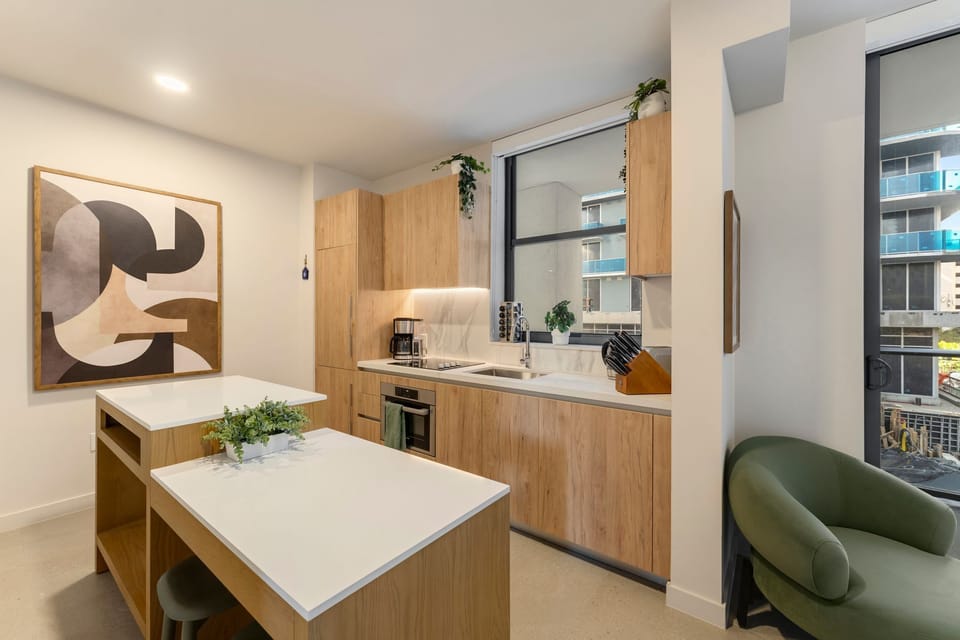 Fully equipped kitchen with spacious island and modern appliances.