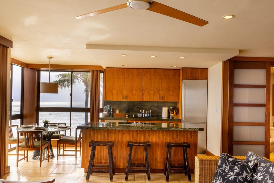 Gourmet kitchen with a view. Fully stocked, microwave and oven built into center island.