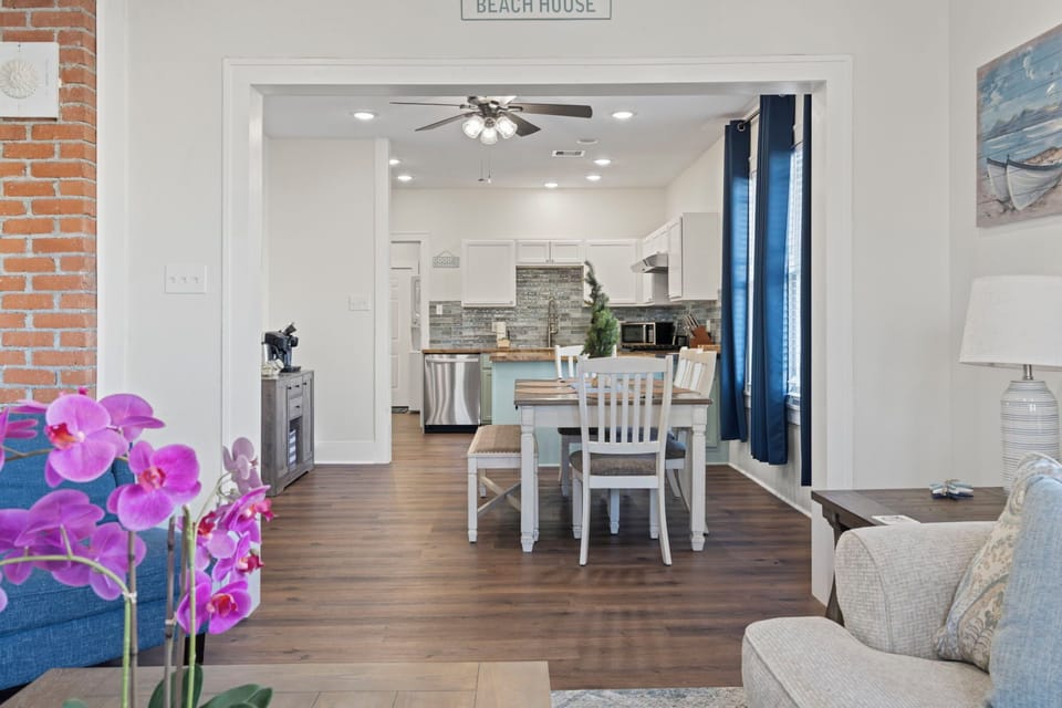 Open-concept living and dining area with coastal charm—easy flow to the kitchen for effortless meals and relaxing hangouts.