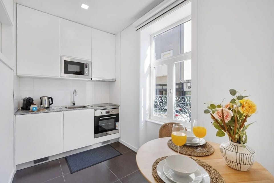 Equipped kitchenette with dining table.