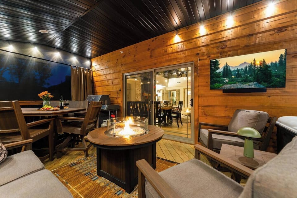 Create lasting memories on this luxury screened deck, where family dinners, fireside conversations, movie nights, and hot tub soaks come together in one inviting outdoor space designed for relaxation and connection