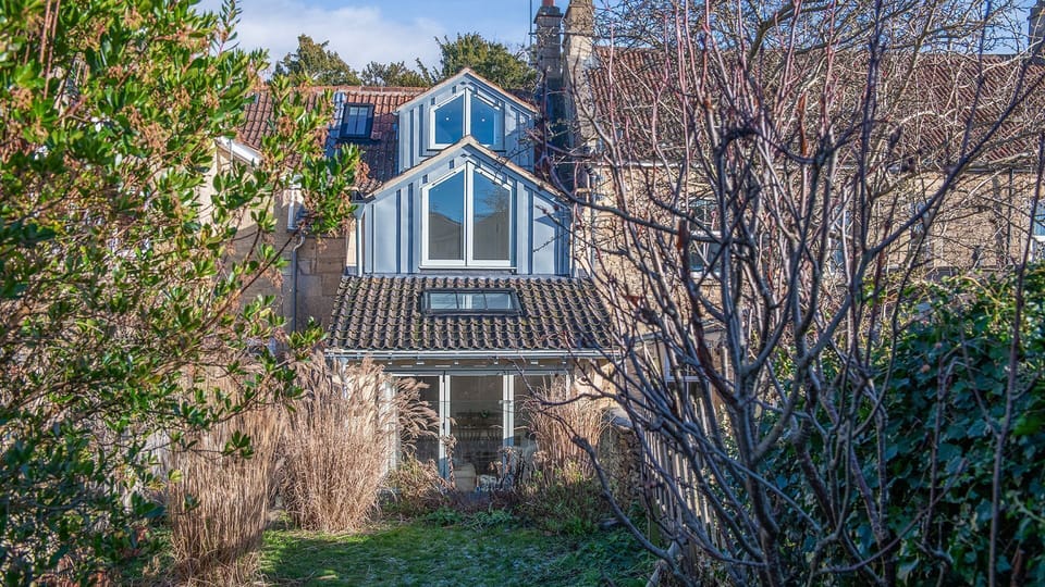 The garden offers lovely views back towards the cottage and its striking three tiered design.