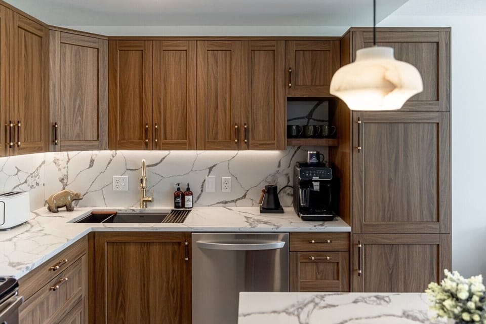 Modern kitchen stocked with essentials for your stay. Fridge, Freezer, Dishwasher, Microwave, Oven and more!