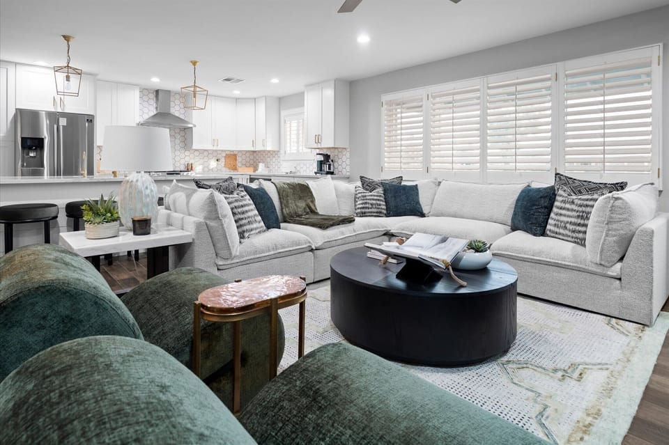 Step into a bright, designer living space. Sink into plush seating, unwind after a day in Old Town, and enjoy effortless flow from lounging to entertaining in a home that feels both elevated and welcoming. Includes 50-inch TV, and assorted games.