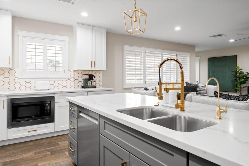 Gather in this beautifully designed fully stocked kitchen with an RO water dispenser. Includes Caraway Pots and Pans, baking set and Jelly roll pans, casserole dishes, 16 place settings and flatware, dishes and utensils for kids. 
