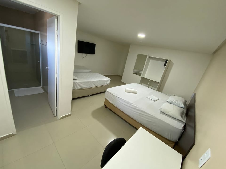 Standard Quadruple Room | Minibar, desk, blackout drapes, iron/ironing board