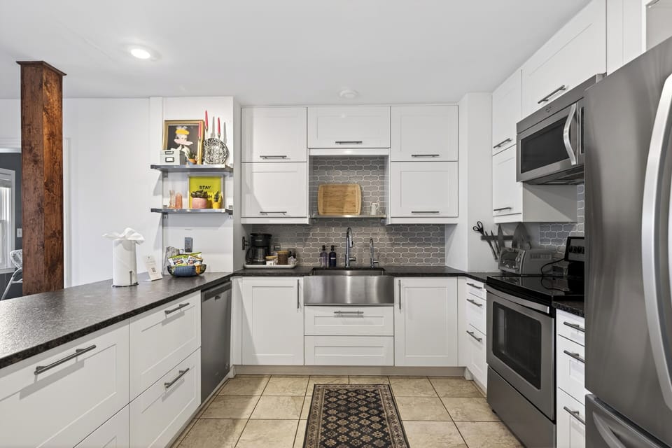 Bright, modern kitchen with stainless steel appliances, ample counter space, and everything you need to cook and gather with ease.
