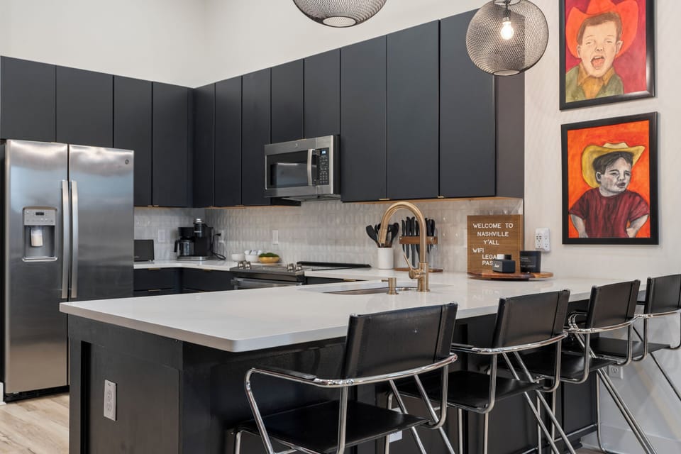 Sleek, modern kitchen with a spacious island—perfect for morning coffee, group meals, and late-night snacks.