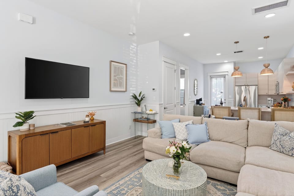 Living room detail featuring a stylish wooden console and neutral decor.