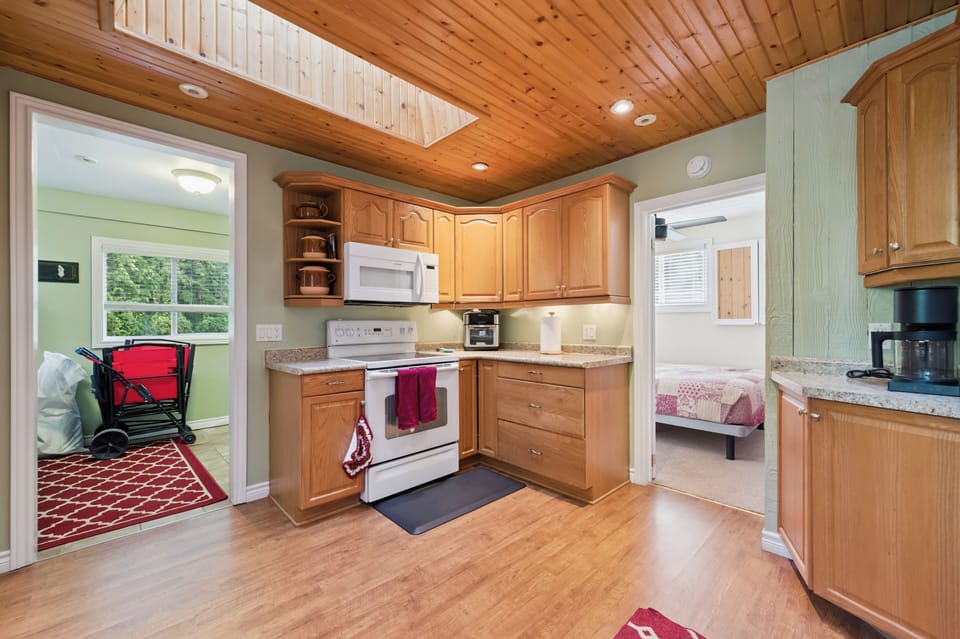 Fully equipped kitchen with plenty of counter space, perfect for cooking meals and snacks during your stay.