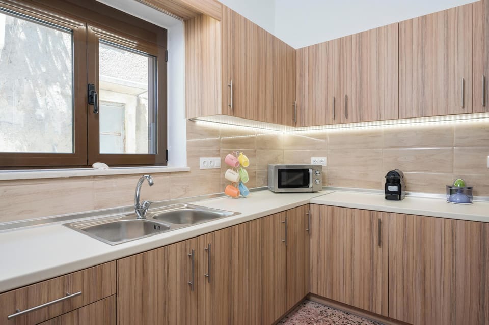 Apartment, Balcony, Sea View | Private kitchen | Espresso maker, coffee/tea maker, full-size fridge, microwave