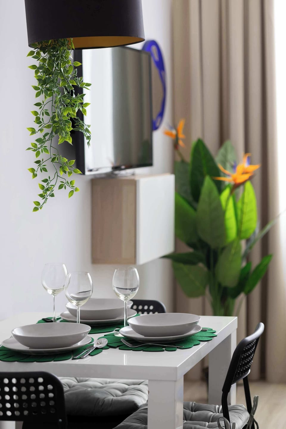 Dining area with table set for two guests.