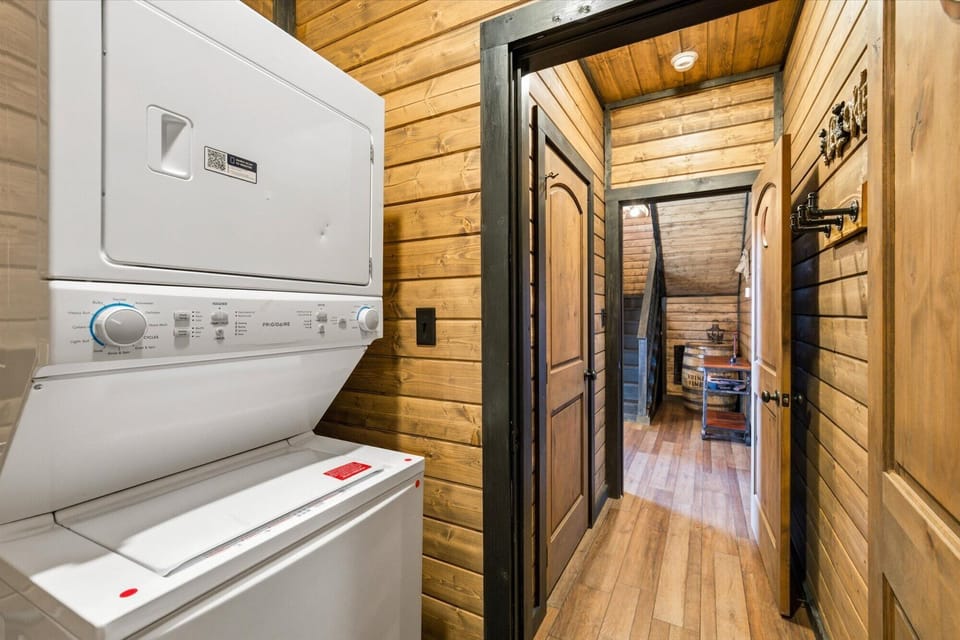 Stacked washer and dryer tucked into the cabin — every comfort covered.
