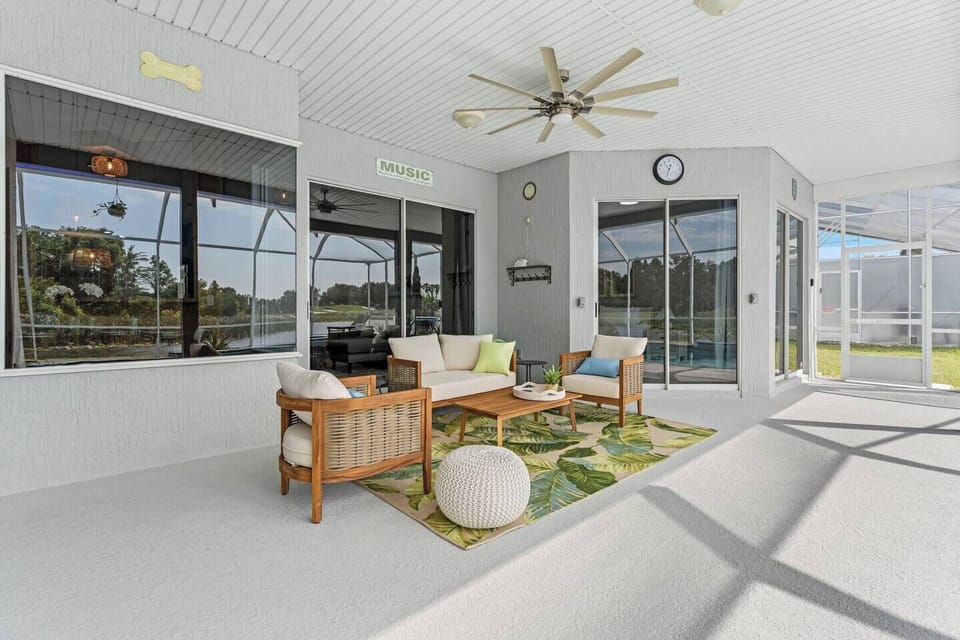 Covered patio with pool and lake views