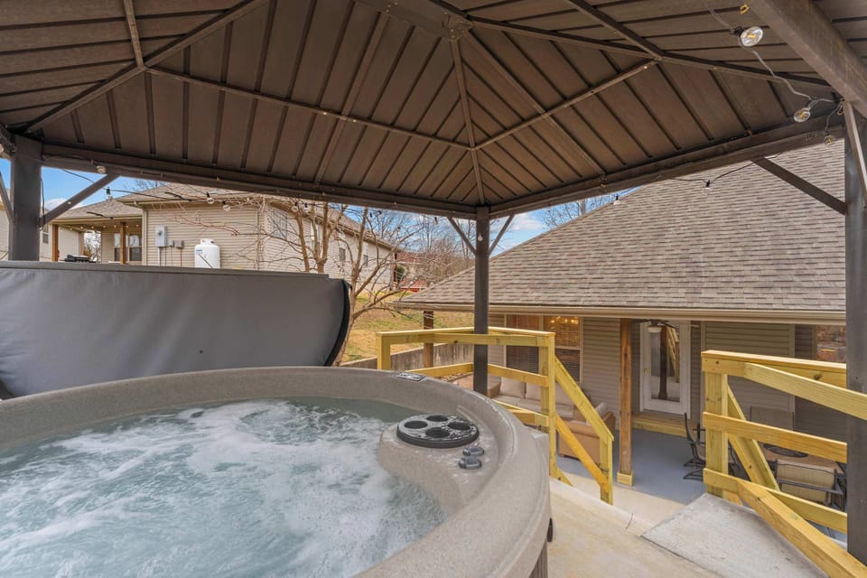 Soak in the covered hot tub in the back yard!