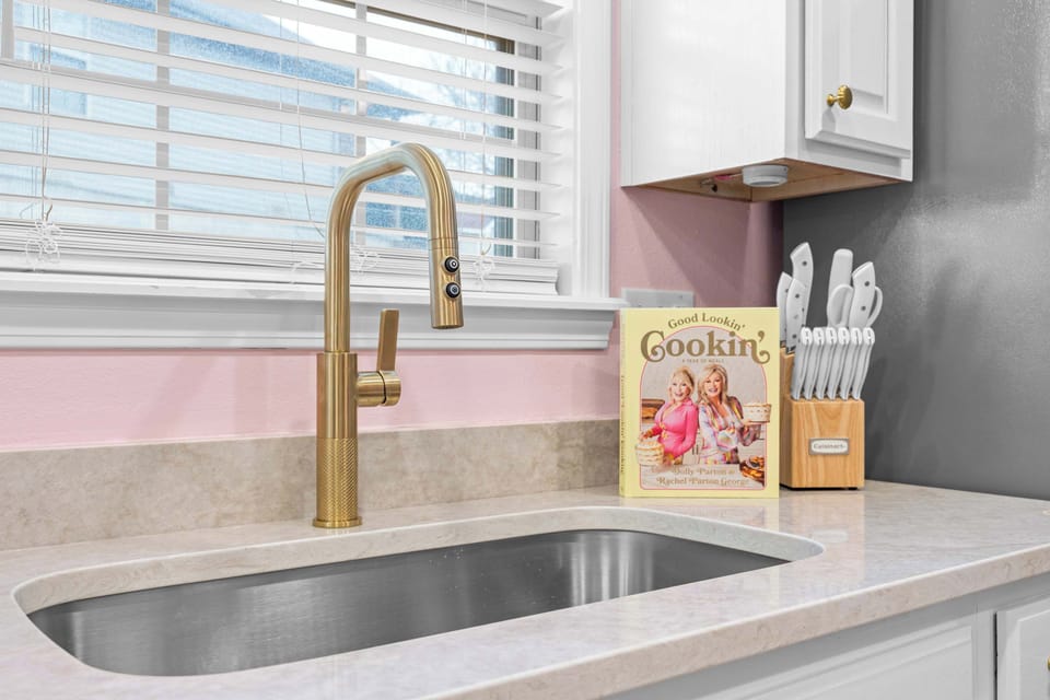 Enjoy the unique, gold faucet in the kitchen!