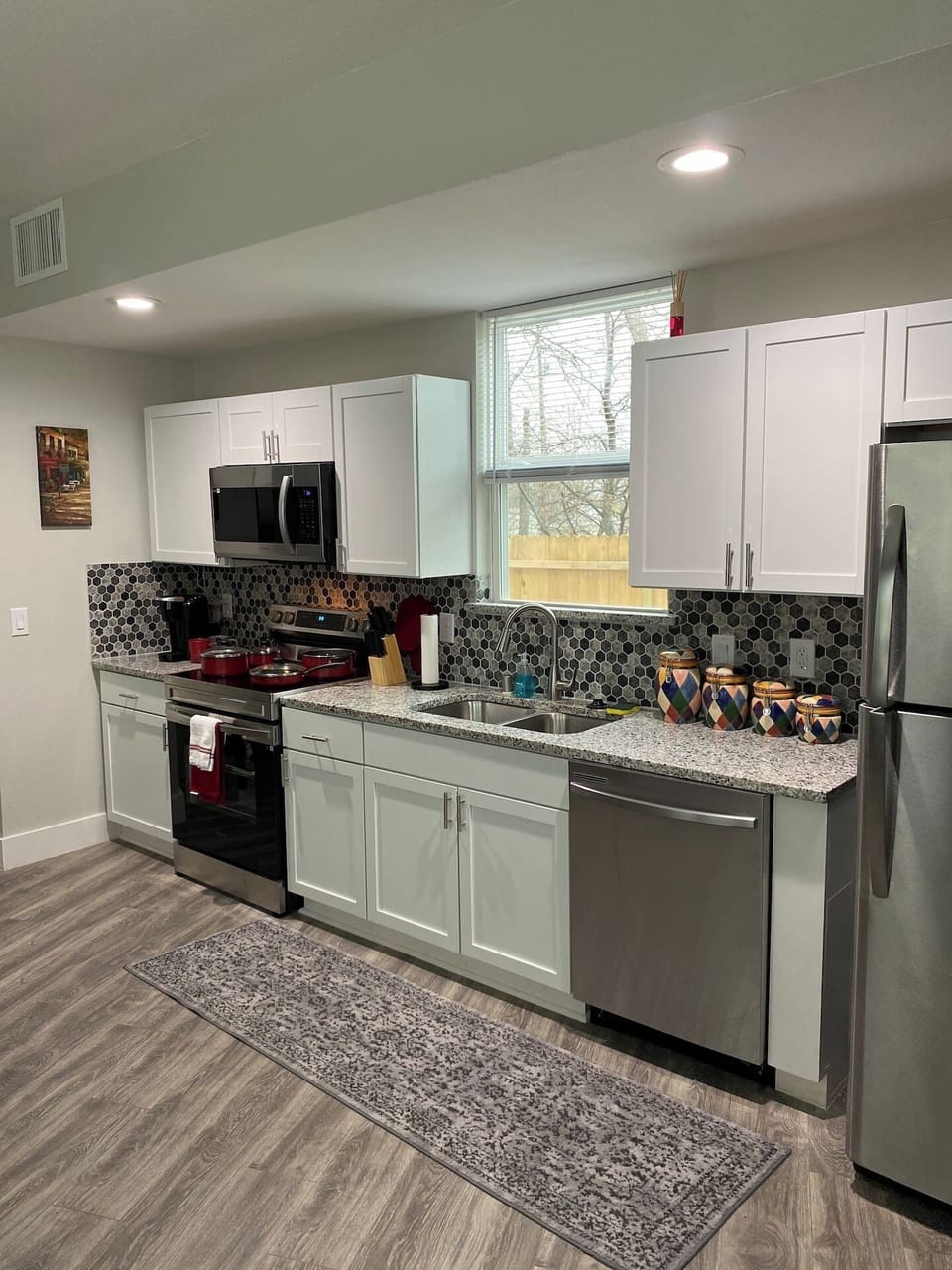 Kitchen  stocked with Keurig coffee maker, (Starbucks K-cups available)  silverware, cookware, dinnerware, stainless steel Refridgerator, free water and snacks.