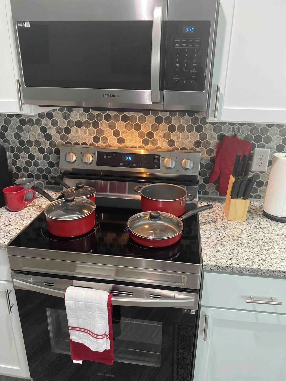 Non-stick cookware,  fast heating oven w/ smooth glass stove burners, silverware, and utensils. Are we missing something…Ahh yes YOU standing in the kitchen, cooking up a meal or just order in, all depends on how you feel