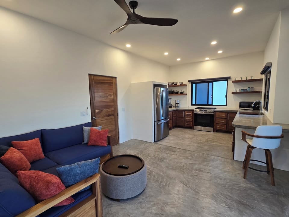 Kitchen and living room on the 1st floor referred to as "Tierra" suite. 