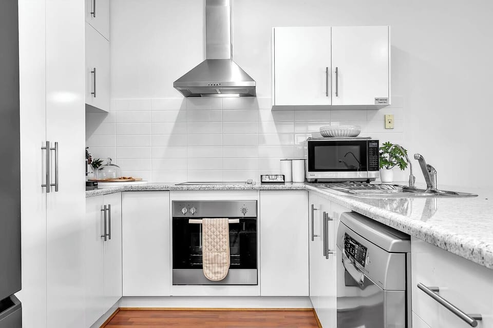 Quality appliances and generous bench space support everything from quick breakfasts to shared dinners at home.