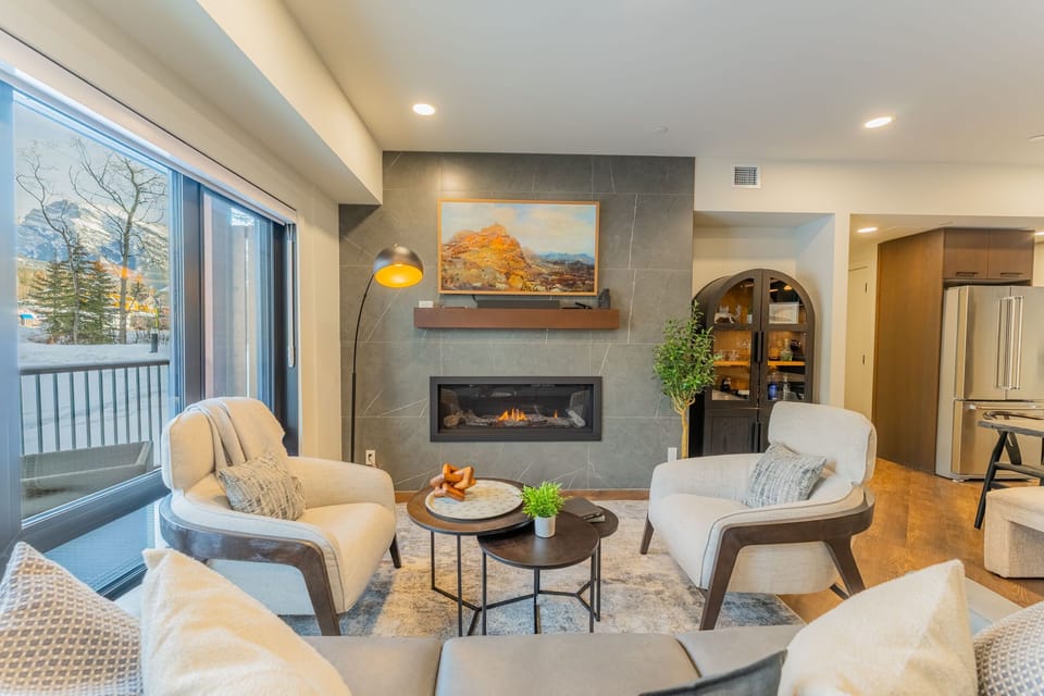 Cozy up by the fireplace and take in the mountain views.