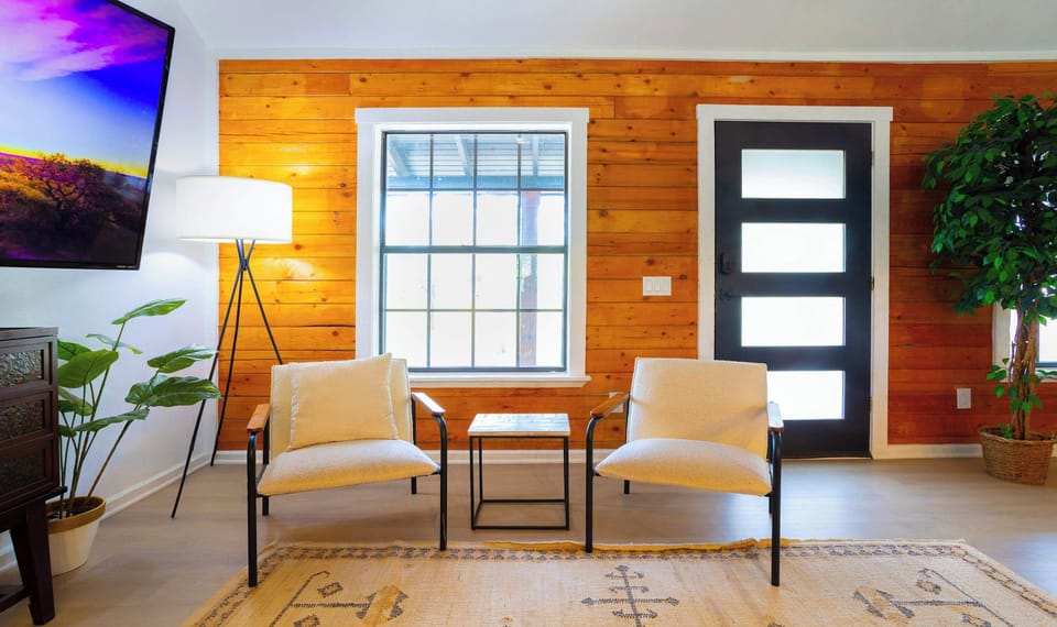Colorful living area with ample seating and Smart TV