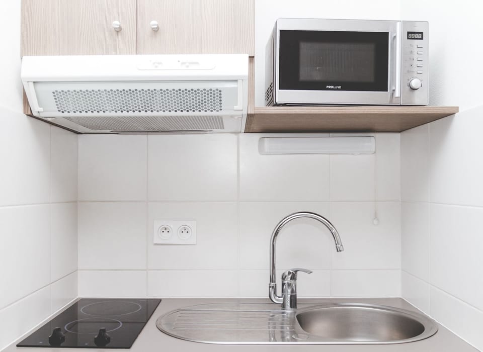 The kitchenette comes with all the essentials for preparing meals and snacks.
