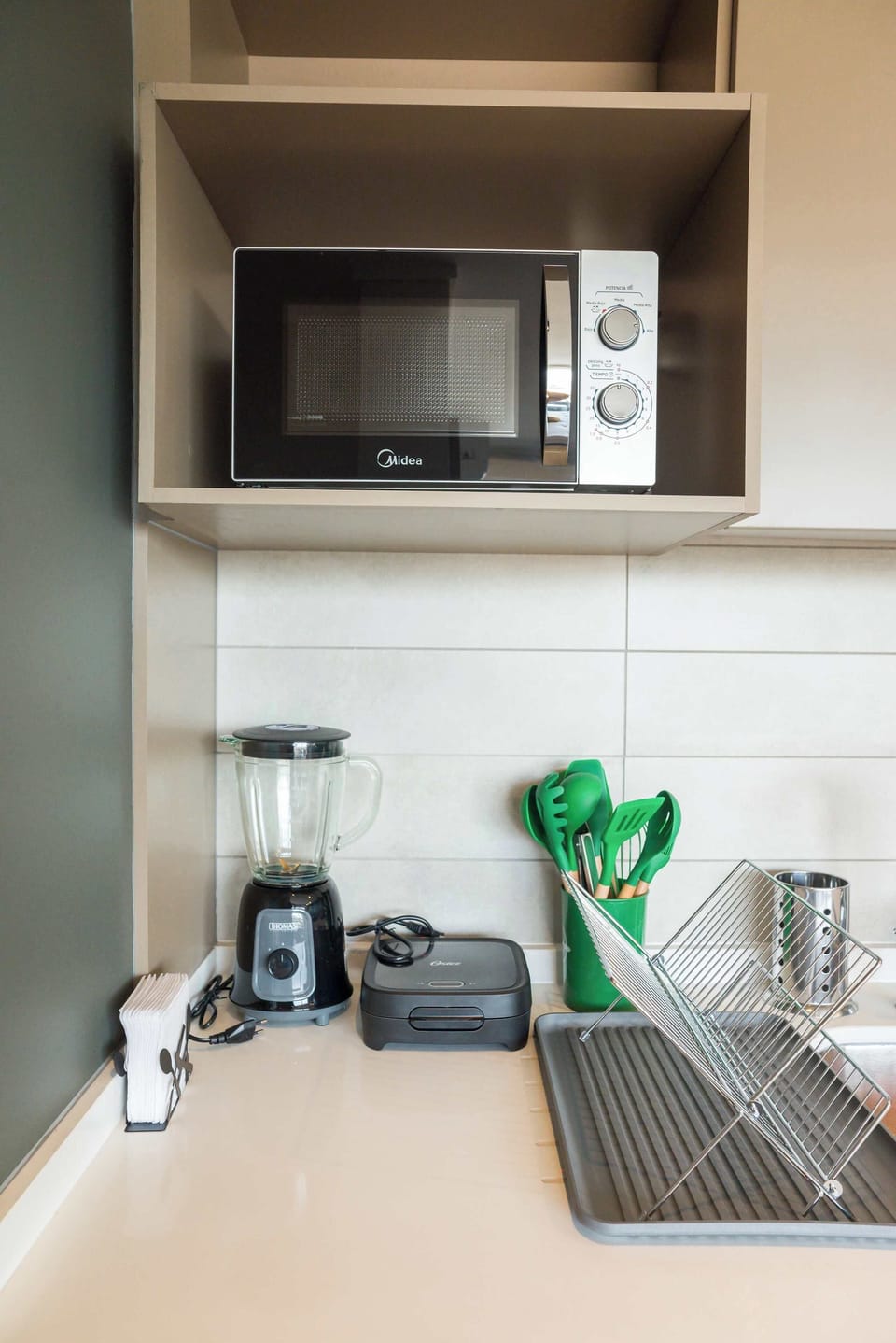 Compact and well-equipped kitchen with modern appliances for convenient meal prep.