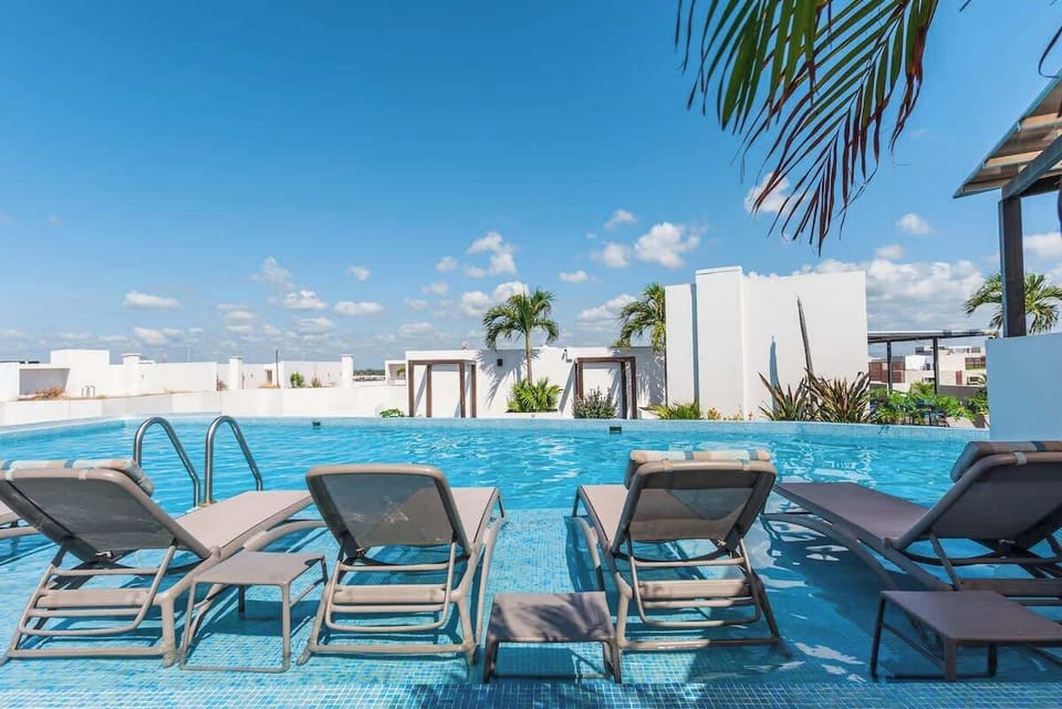 Relax by the pool; your tropical escape awaits!