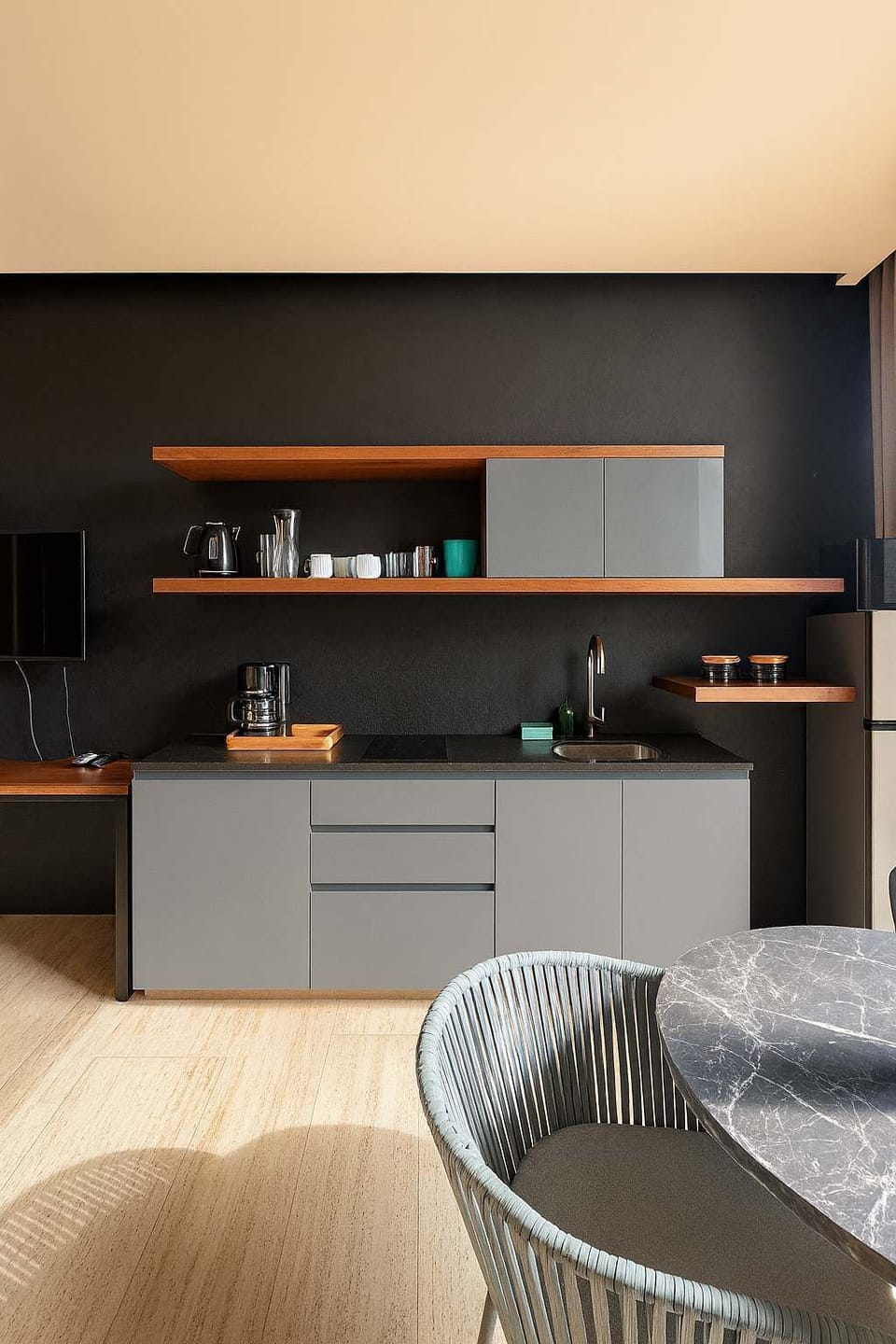 The kitchen area has everything you need to eat inside the apartment if you wish.
