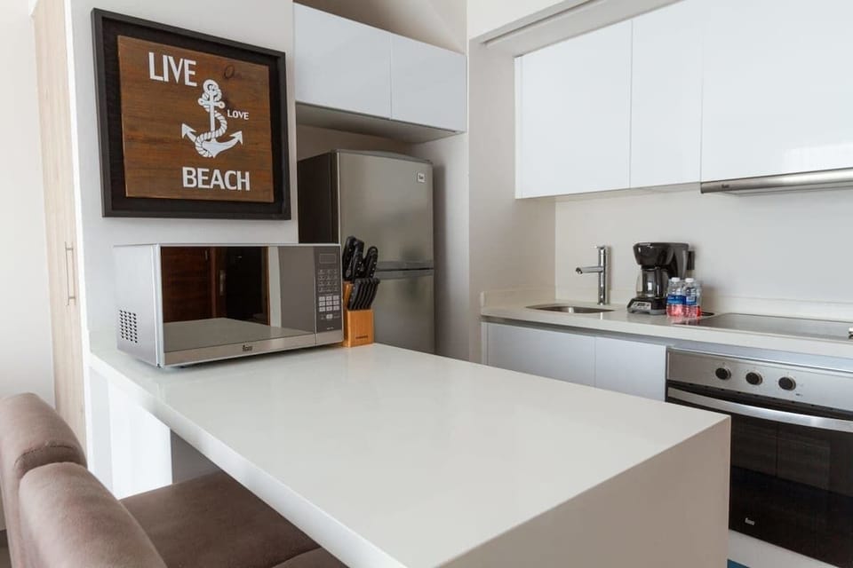 Modern kitchen; fully equipped for cooking.