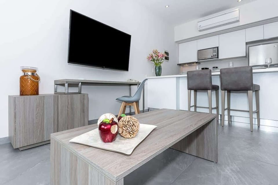 Stylish living space with modern kitchen.