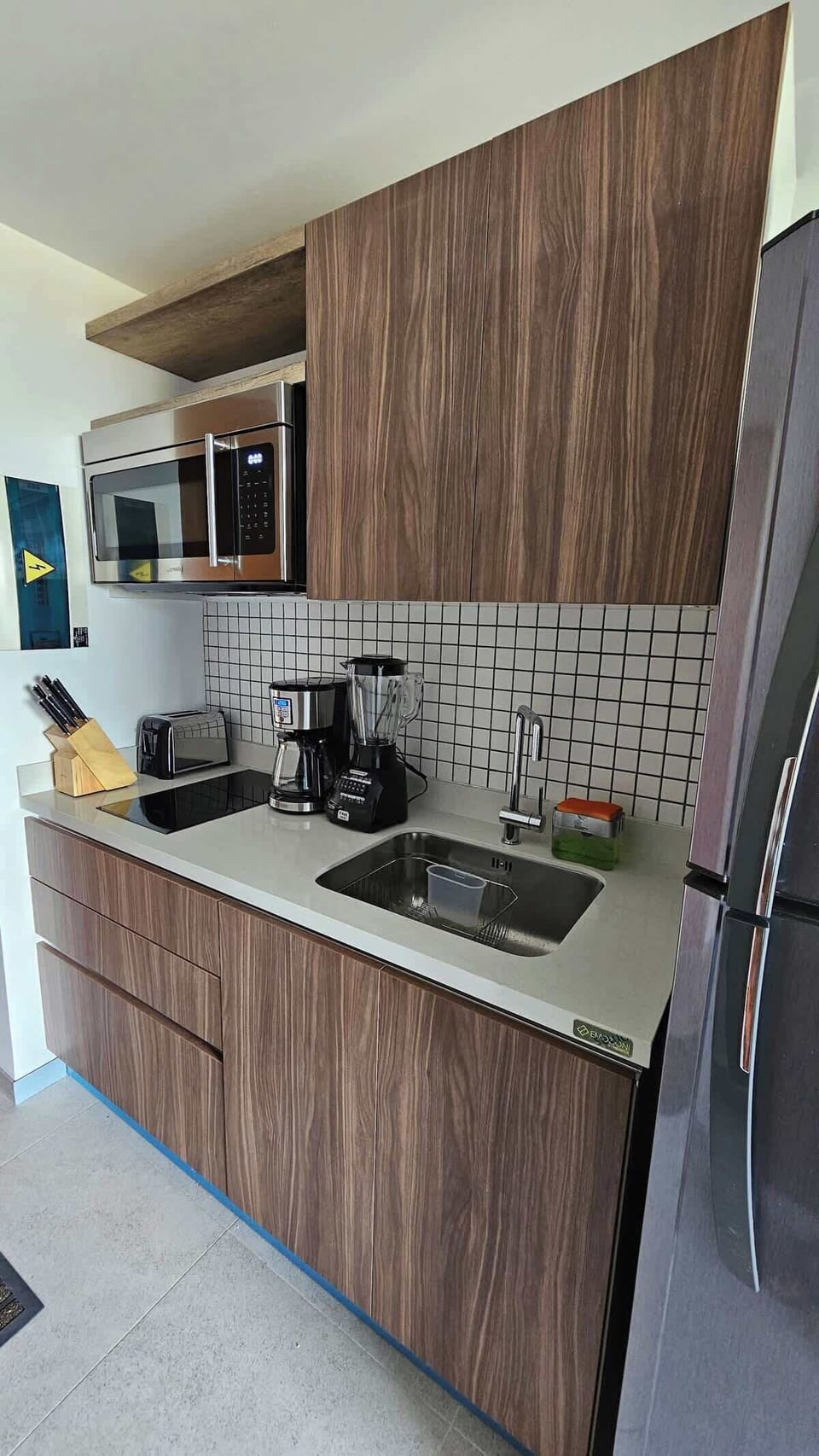 Fully equipped kitchen with modern appliances.