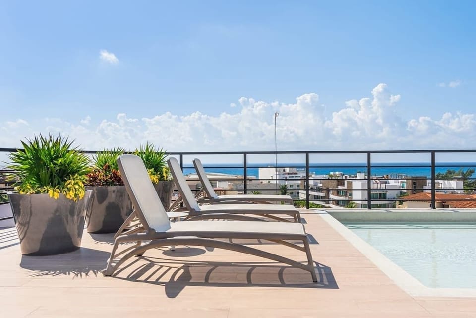 Sunbathe on our rooftop terrace, steps from the ocean!