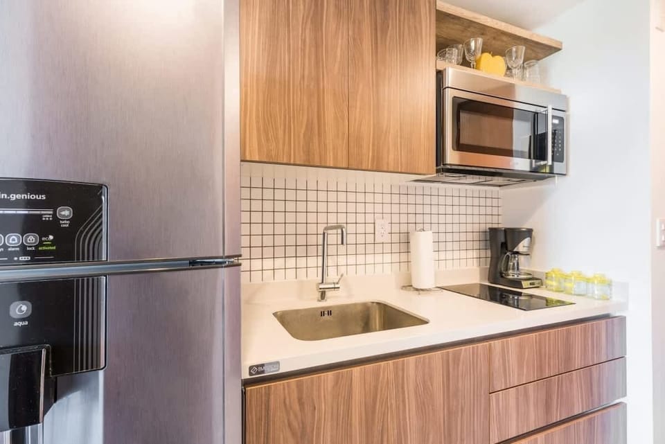 Fully equipped kitchen with modern appliances.
