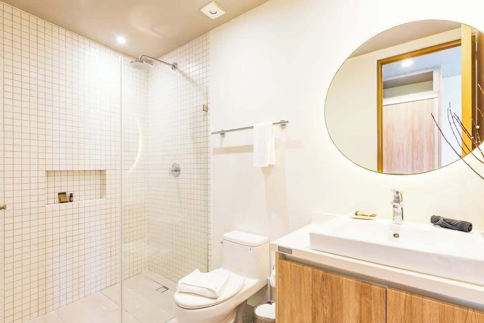 Modern bathroom featuring a walk-in shower.