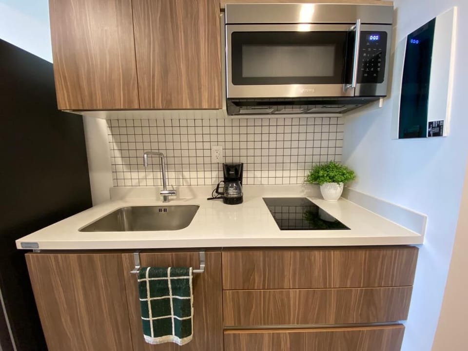 Fully equipped kitchen with modern appliances.