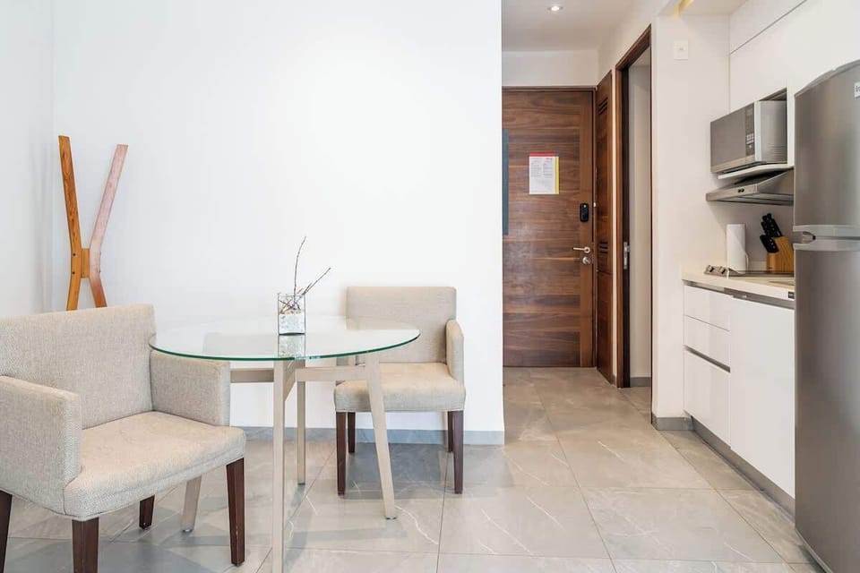 Cozy studio with a dining area for two.