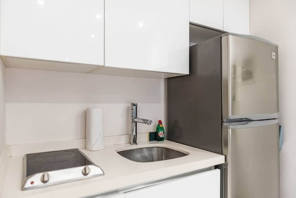 Everything you need to feel at home—microwave, dual electric burners, and spacious fridge with freezer.