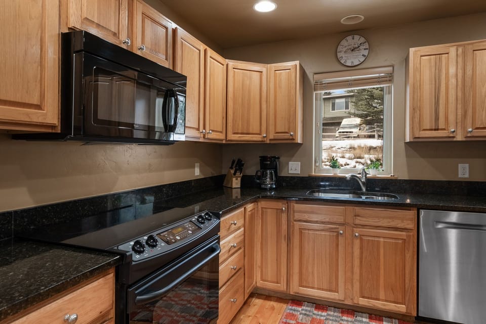 Kitchen: Full-size appliances, butcher block counters, open shelving